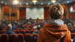 Hall, conference and back of woman in audience for convention, community meeting and workshop. Presentation, auditorium and crowd of people listen in discussion, seminar and speech for town council