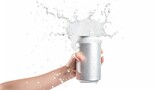 Fototapeta  - A human hand holding open white can with splashing out soda drink on white background. AI generated