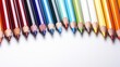 On a white background there is a row of sharpened colored pencils of different colors.
