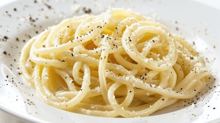 A tasty dish of cacio e pepe pasta against a white backdrop Italian cuisine