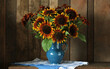 a bouquet of sunflowers in a jug on the table on a dark wooden background.
