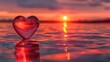 Glass heart capturing the essence of sunset - This striking image features a glass heart-shaped object beautifully ensnaring the setting sun's light on a serene waterfront