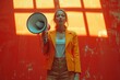Woman in an orange blazer holds a megaphone in front of a magenta wall