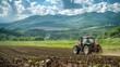 Agricultural tractor cultivating the farmland in a picturesque rural countryside scene