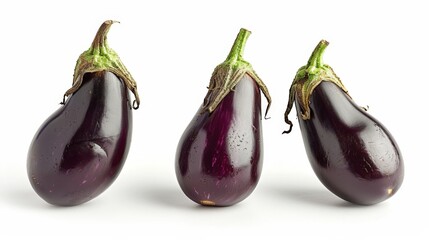 Wall Mural - Three eggplant halves on a white surface