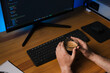 © Andrés Tomasella - Programmer drinking coffee at wooden desk