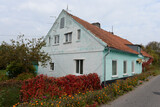 Fototapeta Konie - House on the bank of the Polessky Canal in the village of Belomorskoye, Kaliningrad region