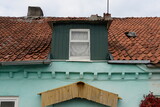 Fototapeta Konie - Fragment of a house on Svetlaya Street in the village of Belomorskoye, Kaliningrad Region
