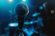 A closeup of an empty microphone on stage, with the background out of focus and dark blue The scene is illuminated by soft lighting that highlights the details of the stand mic