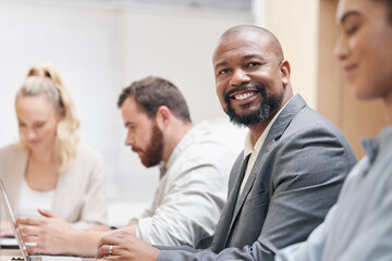 Wall Mural - Portrait, businessman and typing on laptop in meeting, coworking and group in office. Face, smile and professional salesman on pc, entrepreneur and corporate employee working with team in company