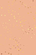Nude background with gold glitter. Pinkish nude color background with yellow gold glitters.
