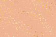 Nude background with gold glitter. Pinkish nude color background with yellow gold glitters.