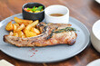 pork chop or grilled pork with French fries and salad