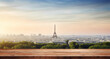 Empty wooden table top with a blurred Paris cityscape