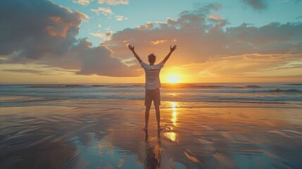 man raising arms up enjoying sunset on the beach looking morning sunrise - Self care, traveling, wellness and healthy life style concept