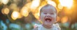 Adorable infant giggling in a soft focus close-up shot outside
