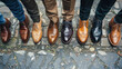 A row of sleek, polished mens shoes in various shades, lined up neatly in a symmetrical formation