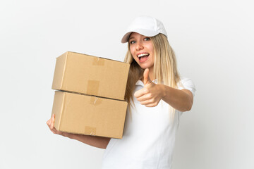 ¬°Young delivery woman isolated on white background with thumbs up because something good has happened