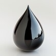 A reflective black droplet with a glossy finish isolated on a white background, embodying purity and elegance.
