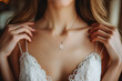 wedding pendant with a diamond on neck of bride girl in white dress with a cleavage on chest