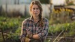 © Attasit - Portrait of a confident female farmer in plaid shirt and work gloves, exuding strength and passion for the land