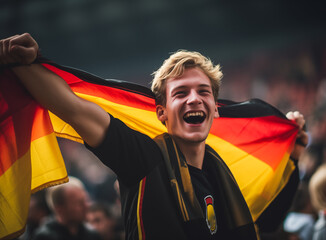 Wall Mural - Happy German fan at stadium with flag in german color.