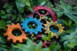 Macro photo showcasing a set of colorful interlocking wooden gears nestled in lush foliage