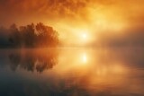 Fototapeta  - Dense fog rolling over a tranquil lake at sunrise.