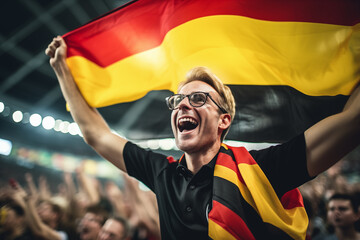 Wall Mural - Happy German fan at stadium with flag