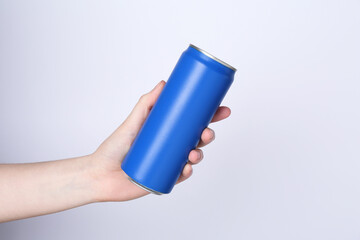 Poster - Woman with energy drink on light grey background, closeup