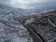 Wanaka, New Zealand: Aerial footage of the crown range mountain pass road between Wanaka and Queenstown in the southern alps in winter in New Zealand