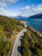Queenstown, New Zealand: Aerial view of the coastal road along the lake Wakapitu leading to Glenorchy from Queenstown in New Zealand south island on a sunny winter day