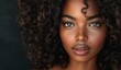 © Photo Designer 4k - Beautiful African American woman with long curly hair on black background