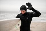 Fototapeta  - Happy smiling male surfer out of water, water drops visible on face