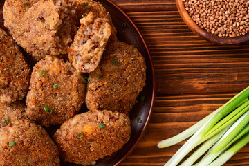 Wall Mural - Healthy vegetarian food background photo . Fried buckwheat cutlets