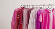 women's clothing in pink and burgundy trendy colors on a hanger