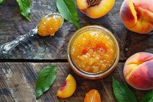 Sweet Peach Jam In Homemade Jar. Top View Of Berry And Orange Jam With Spoon On Side