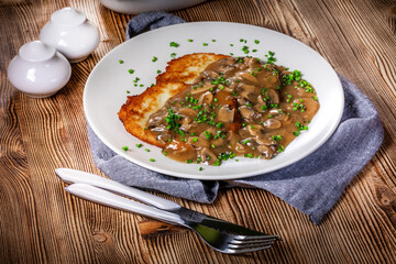 Wall Mural - Crispy potato pancakes with mushroom sauce