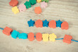 Wooden beads used to making bracelet. Development of kids motor skills, coordination and logical thinking
