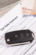 Car sale contract, car key and euro banknotes. Sales, purchases of vehicle