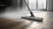 A steam mop effortlessly cleans a hardwood floor, removing dirt and grime with ease.
