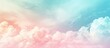Gradient pastel colors create a soft, cloudy abstract sky background in gentle hues.