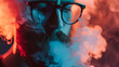 Close-up portrait of a bearded man with glasses and a beard in the smoke. The concept of smoking and vaping.