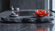 Spa interior with black marble minimalistic Japanese product display with lilies.