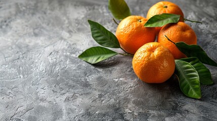 Sticker - Four oranges with stems arranged on a tabletop