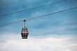 Suspended in the air, the gondola glides effortlessly along the steel rope, creating a sense of excitement and adventure.