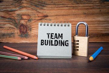 Wall Mural - team building. cardboard notepad on wooden texture table