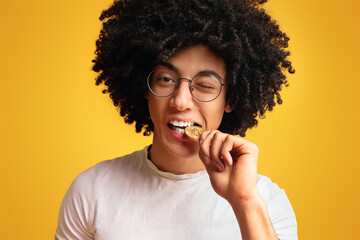 Poster - Black man biting golden bitcoin close up