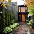 Main entrance door. Japanese, minimalist style exterior of cottage in fall forest. Tiled walls and wooden front door. Front yard with beautiful landscape design.
