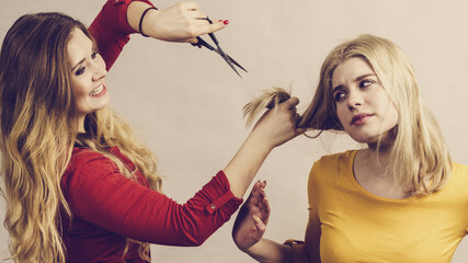 Wall Mural - Woman with scissors ready to hair cutting